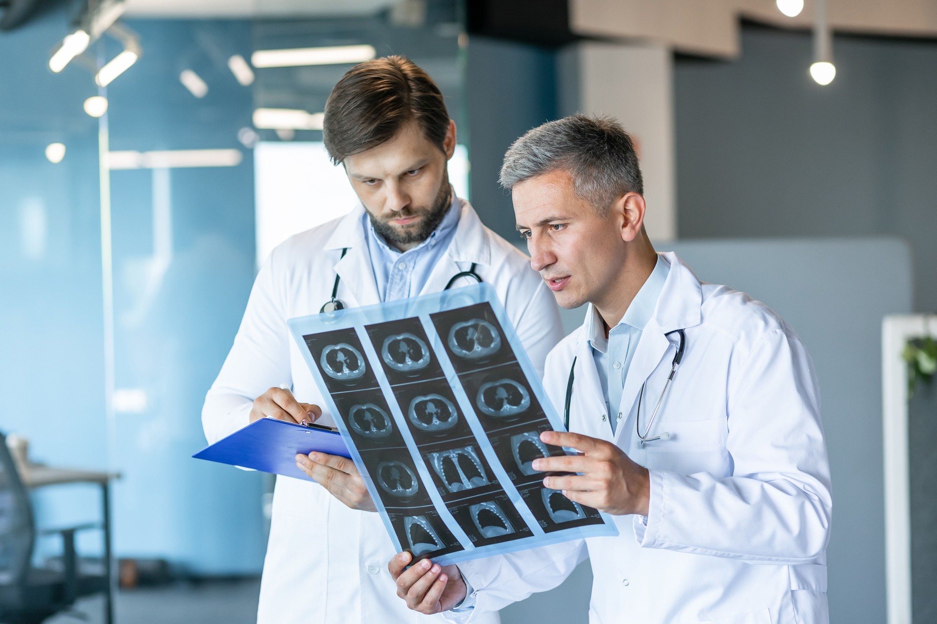 Doctors Analyzing X-Ray Scans in Modern Hospital Office
